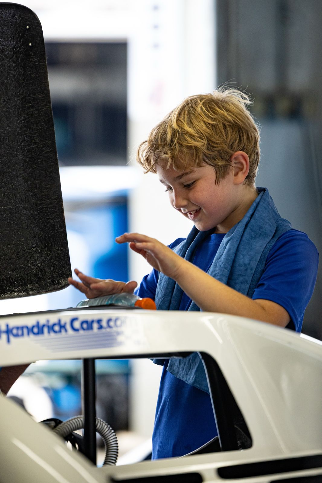 Kip smiling beside his HendrickCars.com Bandolero