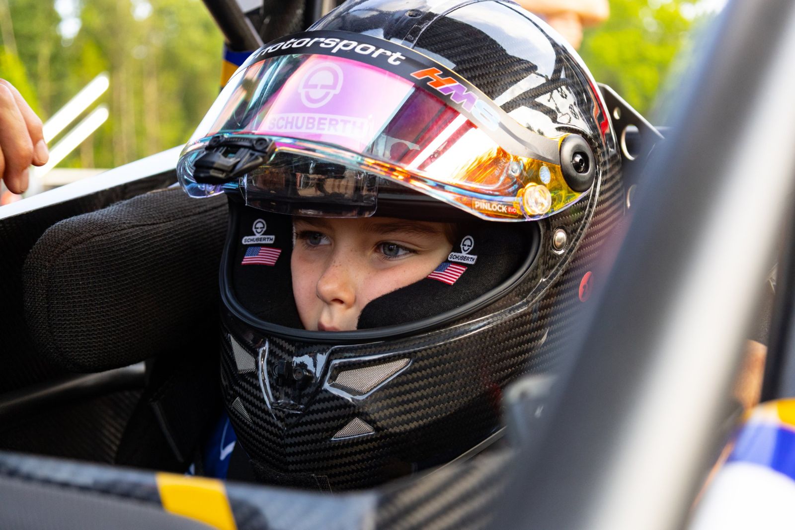 Kip strapped into his Bandolero cockpit in a carbon helmet, eyes locked ahead