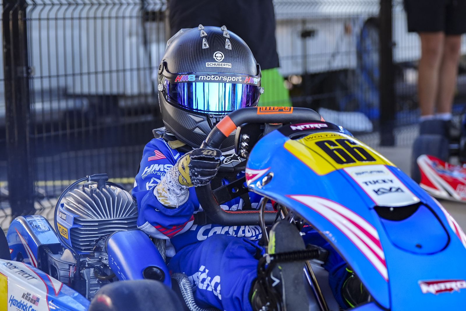Kip giving a thumbs up from the No. 66 kart on the grid