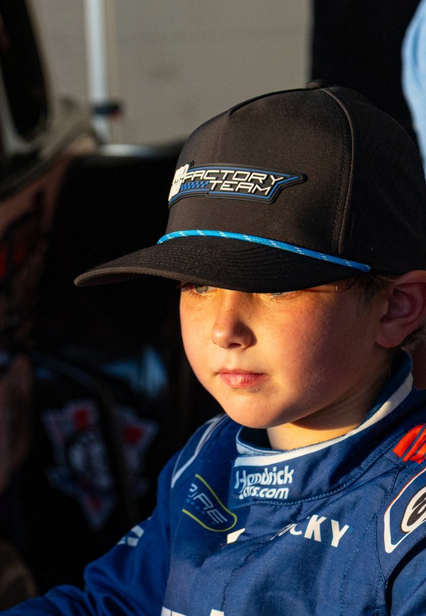 Kip in his Factory Team hat and HendrickCars.com fire suit at an autograph session
